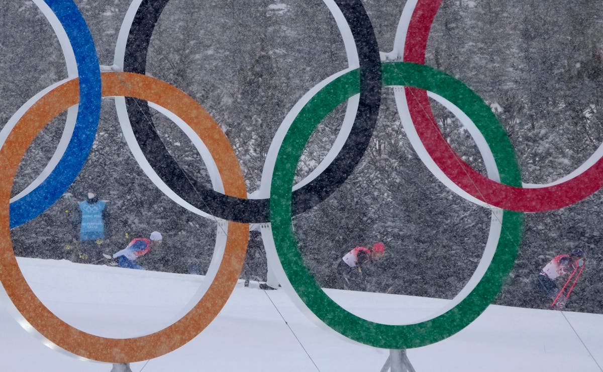 AP PHOTOS: Snow delights &mdash; and disrupts &mdash; Beijing Olympics