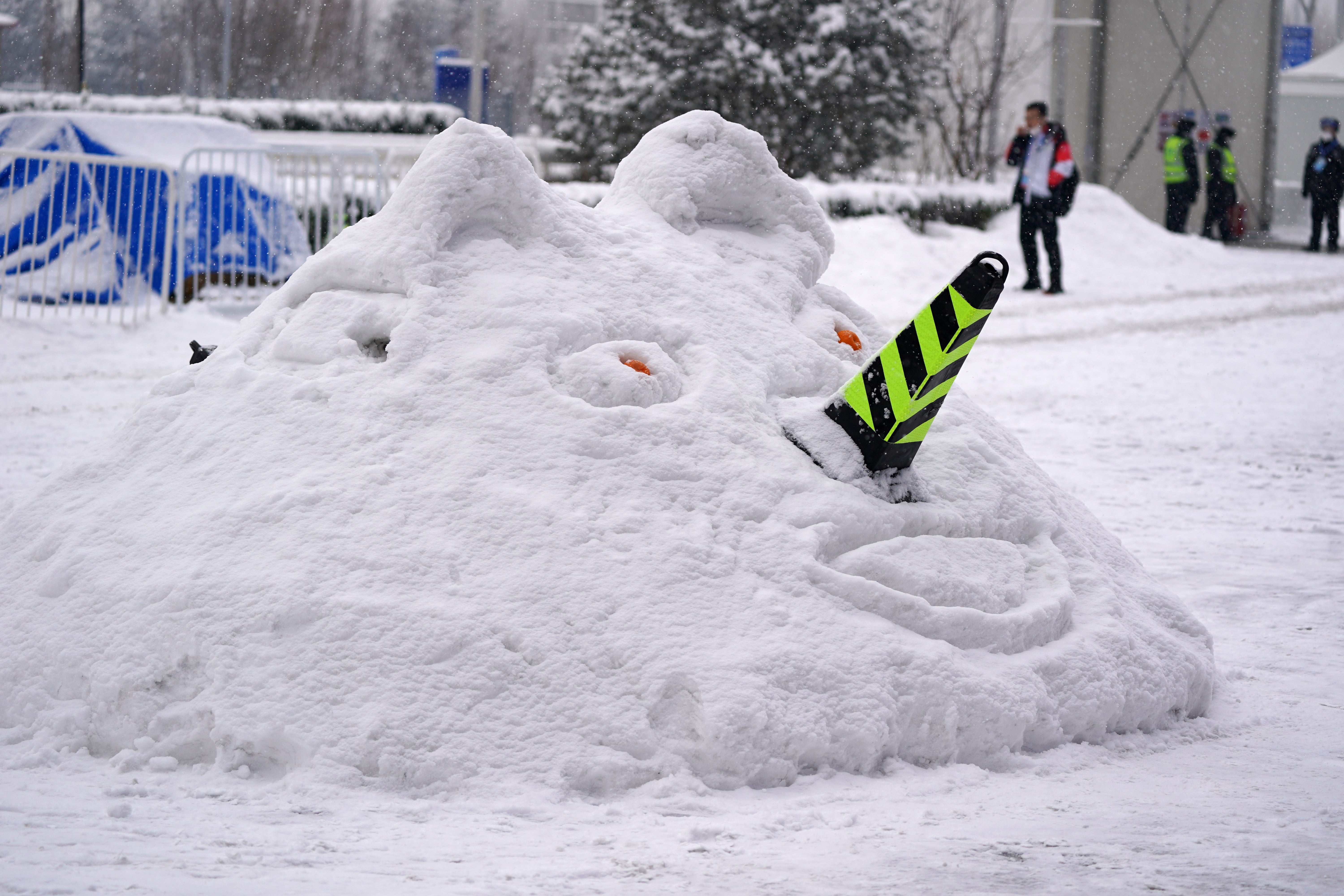 A snowman is built outside the National Aquatics Centre during day nine of the Beijing 2022 Winter Olympic Games in China (Andrew Milligan/PA)