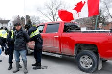 Canada trucker protest - live: Ontario declares state of emergency as protesters outnumber police in Ottawa