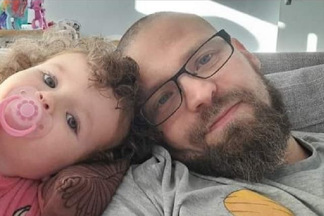Mark Cummins, 37, with his two-year-old daughter Shannon, whom he resuscitated with the help of an emergency phone operator after she stopped breathing (Mark Cummins/PA)