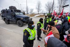 Trucker protest: Canada-US bridge reopens as police clear six-day blockade