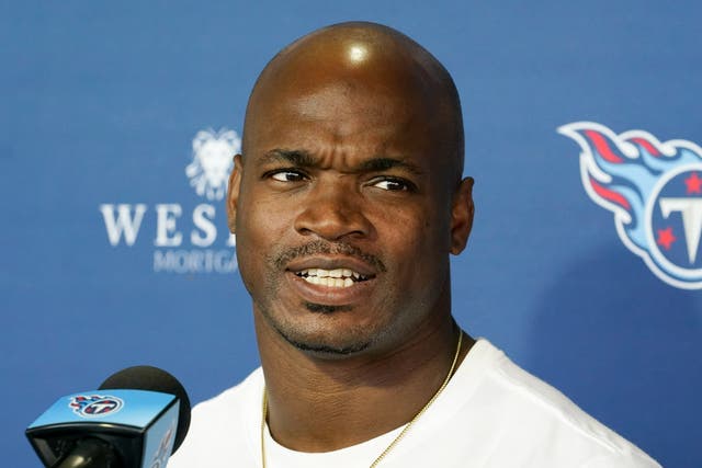 <p>Adrian Peterson answers press questions in Tennessee in November 2021 </p>