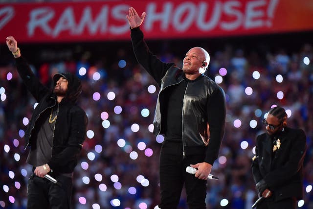 <p>Dr Dre (centre) with Eminem and Kendrick Lamar at the Super Bowl halftime show</p>