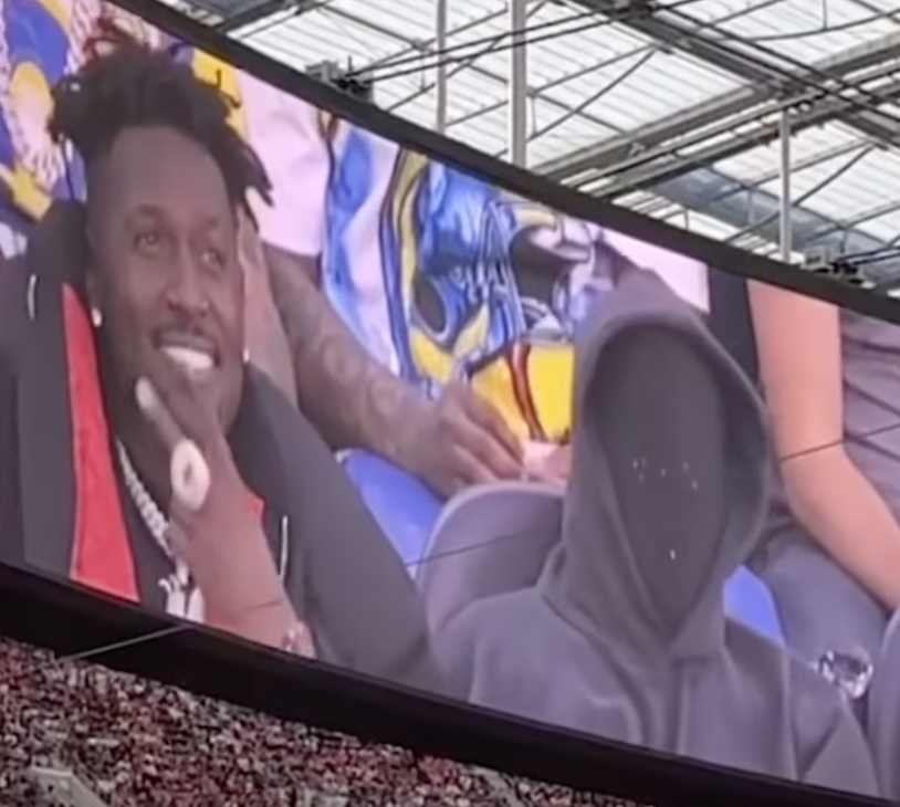 <p>Kanye West was filmed wearing a black mask covering his face when he was featured on the jumbotron </p>