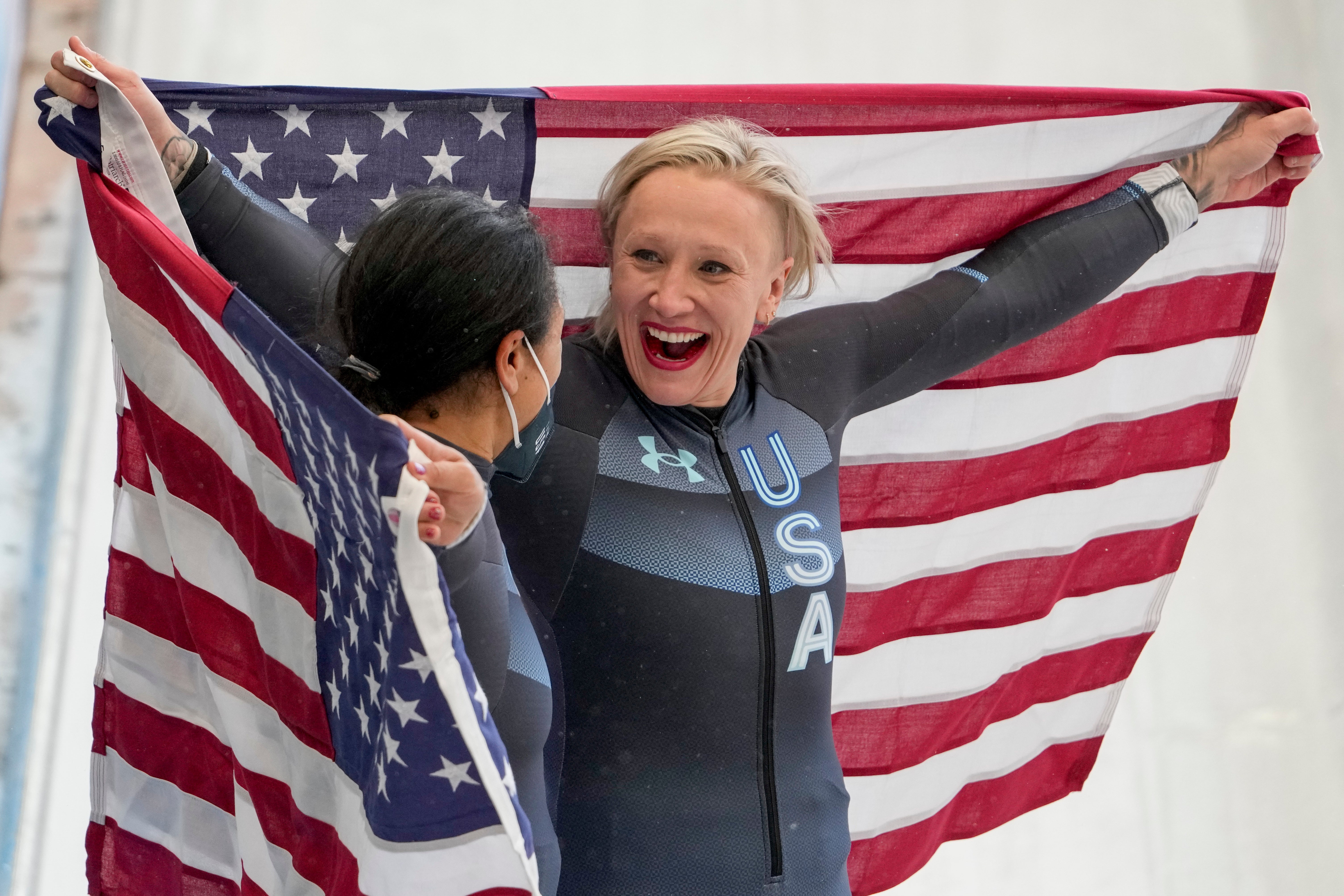 Kaillie Humphries (right) has won three Olympic gold medals