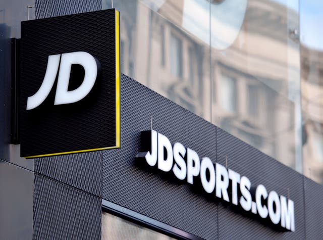 A shop sign for JD Sports in central London. The UK competition regulator has fined JD Sports and Footasylum almost £5m over breaking merger rules (Nick Ansell/PA)