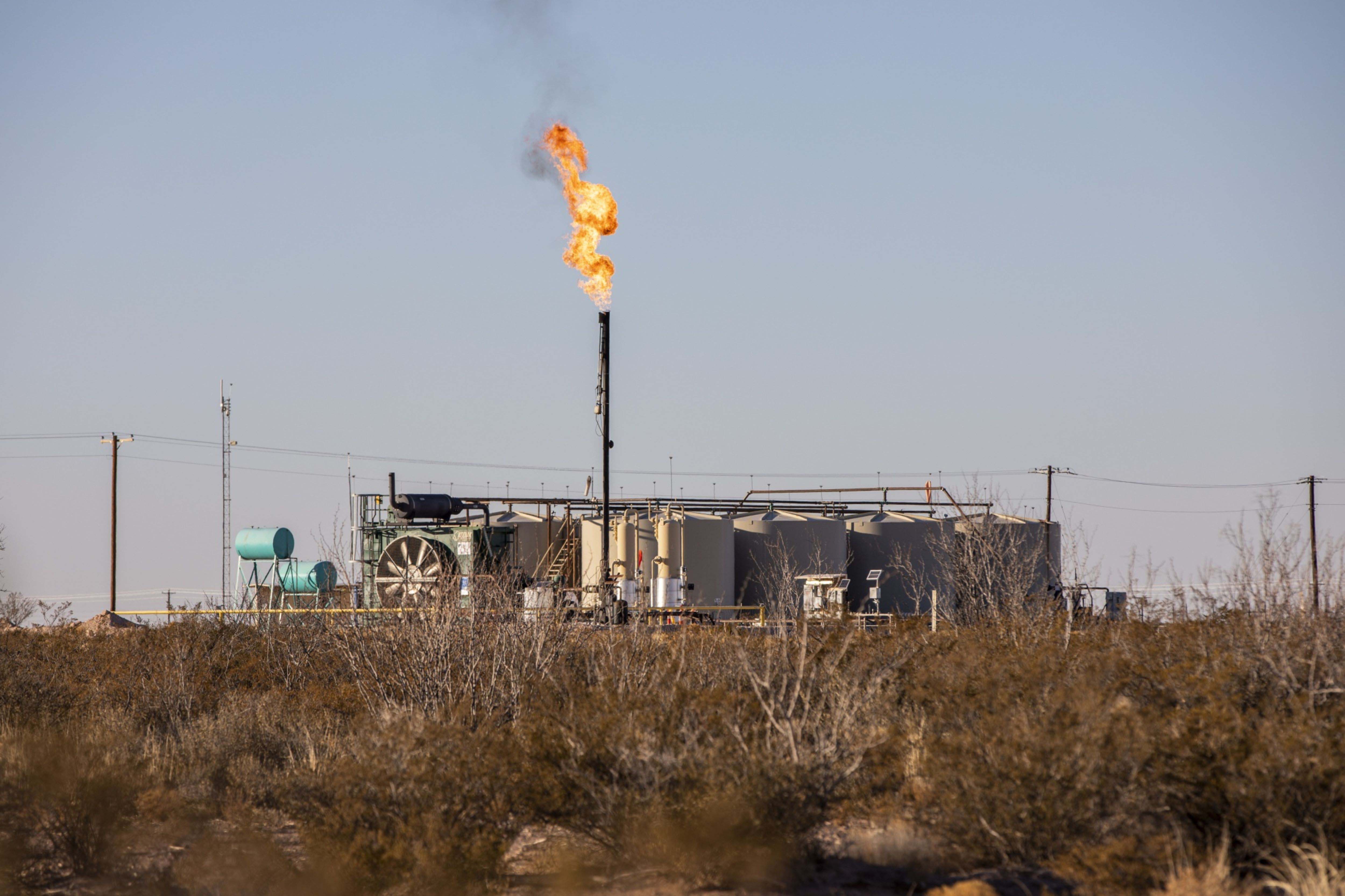 A flare burns off excess natural gas near Monahans, Texas