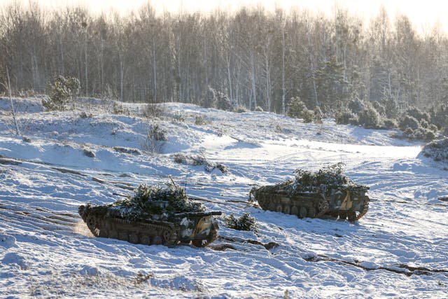 Armoured vehicles move at the Gozhsky training ground during the Union Courage-2022 Russia-Belarus military drills in Belarus (BelTA via AP)