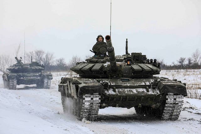 <p>Russian servicemen drive tanks during military exercises in the Leningrad Region, Russia, 14 February 2022</p>