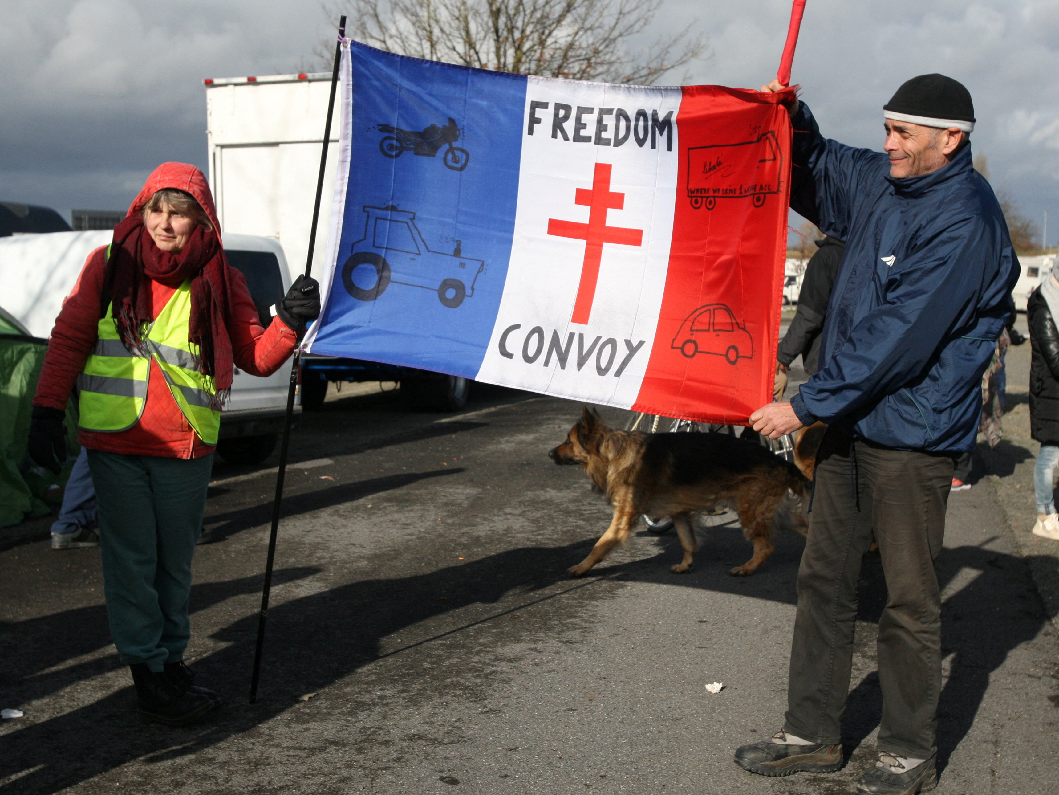 Demonstrators protesting against Covid restrictions as part of ‘European Freedom Convoy 2022’ wait in a car park in Brussels