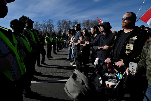 <p>Delta Police and RCMP officers held a line of protesters who blocked access to the border, as they continue to protest the coronavirus disease (COVID-19) vaccine mandates, in Surrey, British Columbia, Canada</p>