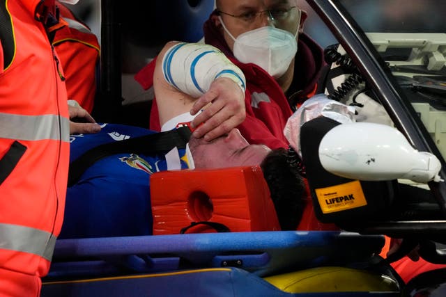 Italy’s Sebastian Negri is taken off the pitch after getting injured against England (Gregorio Borgia/AP).