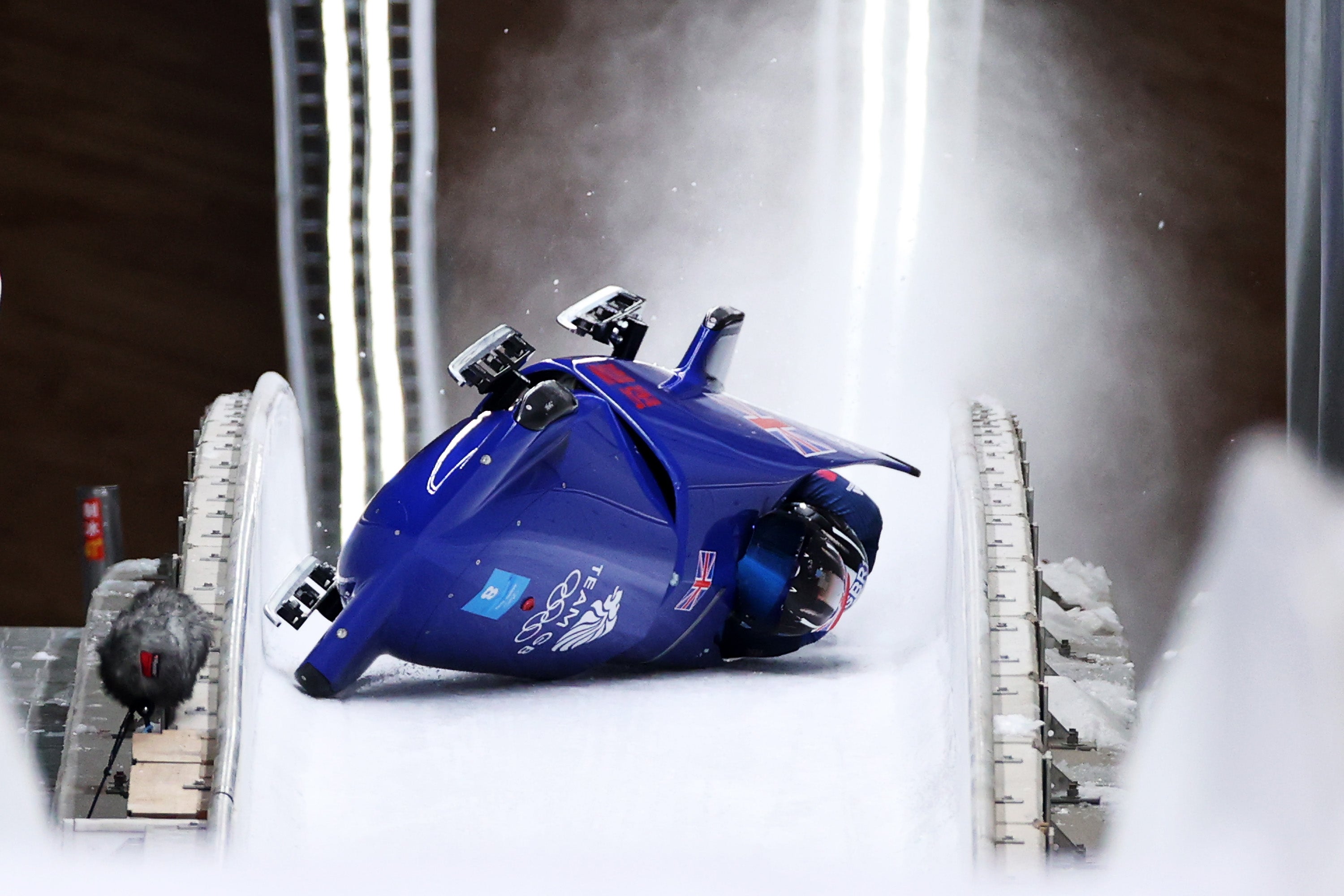 Brad Hall and Nick Gleeson of Team Great Britain crash during the 2-man Bobsleigh Heat 3