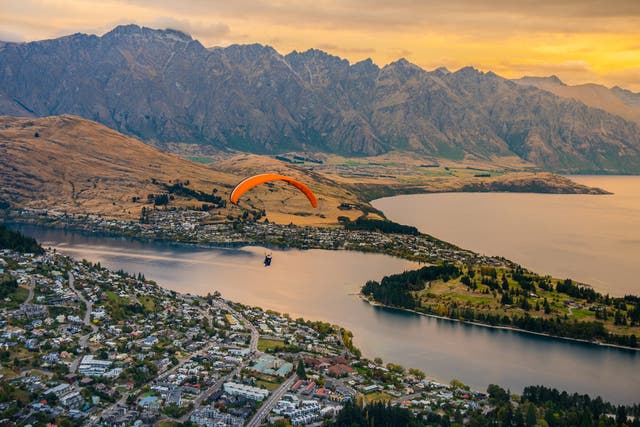 <p>Paragliding over adventure capital Queenstown, New Zealand</p>