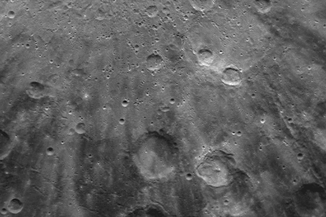 <p>Secondary impact craters radiate out from the primary Debussy crater on Mercury</p>