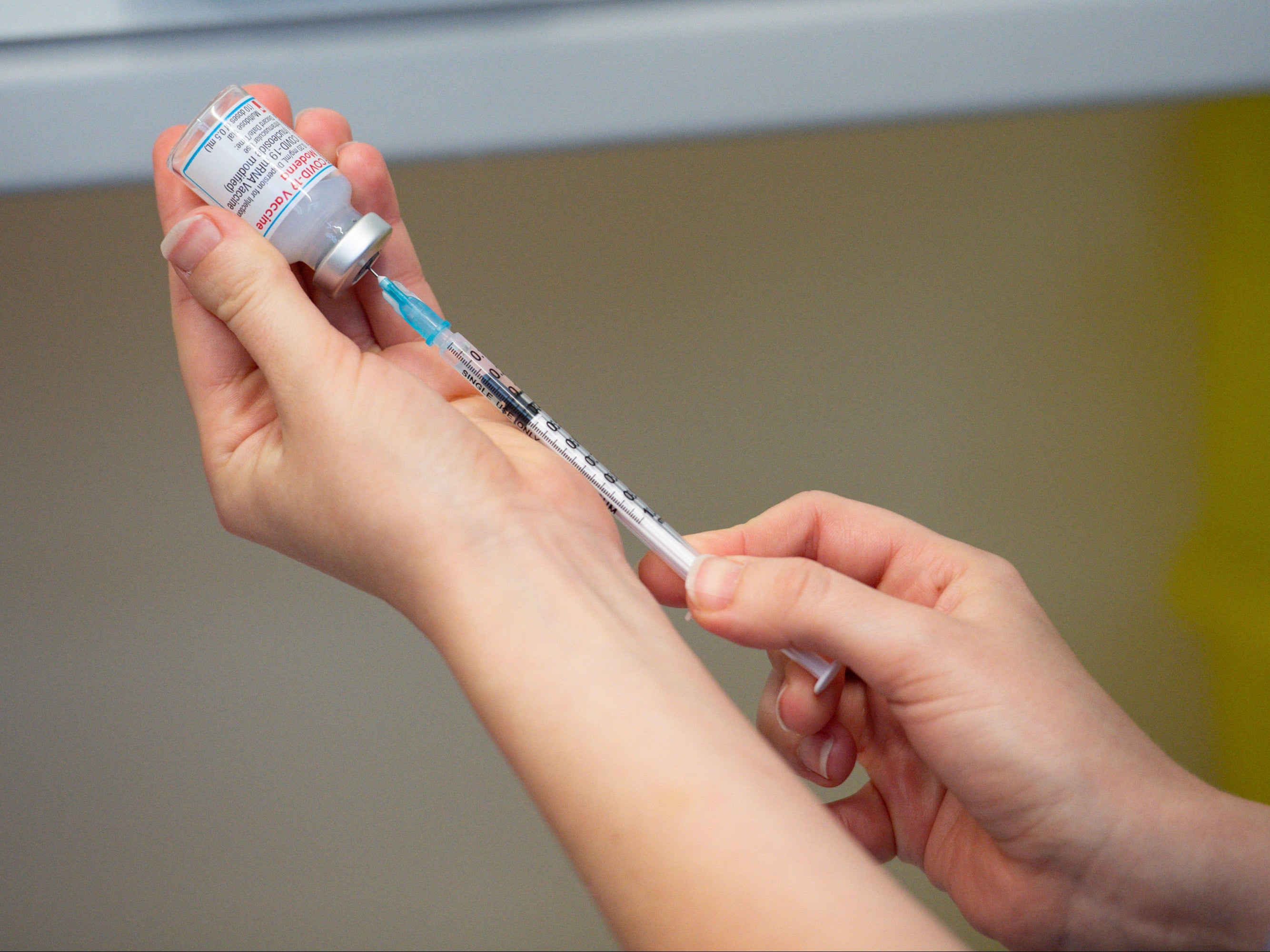 A nurse prepares the Moderna Covid-19 vaccine