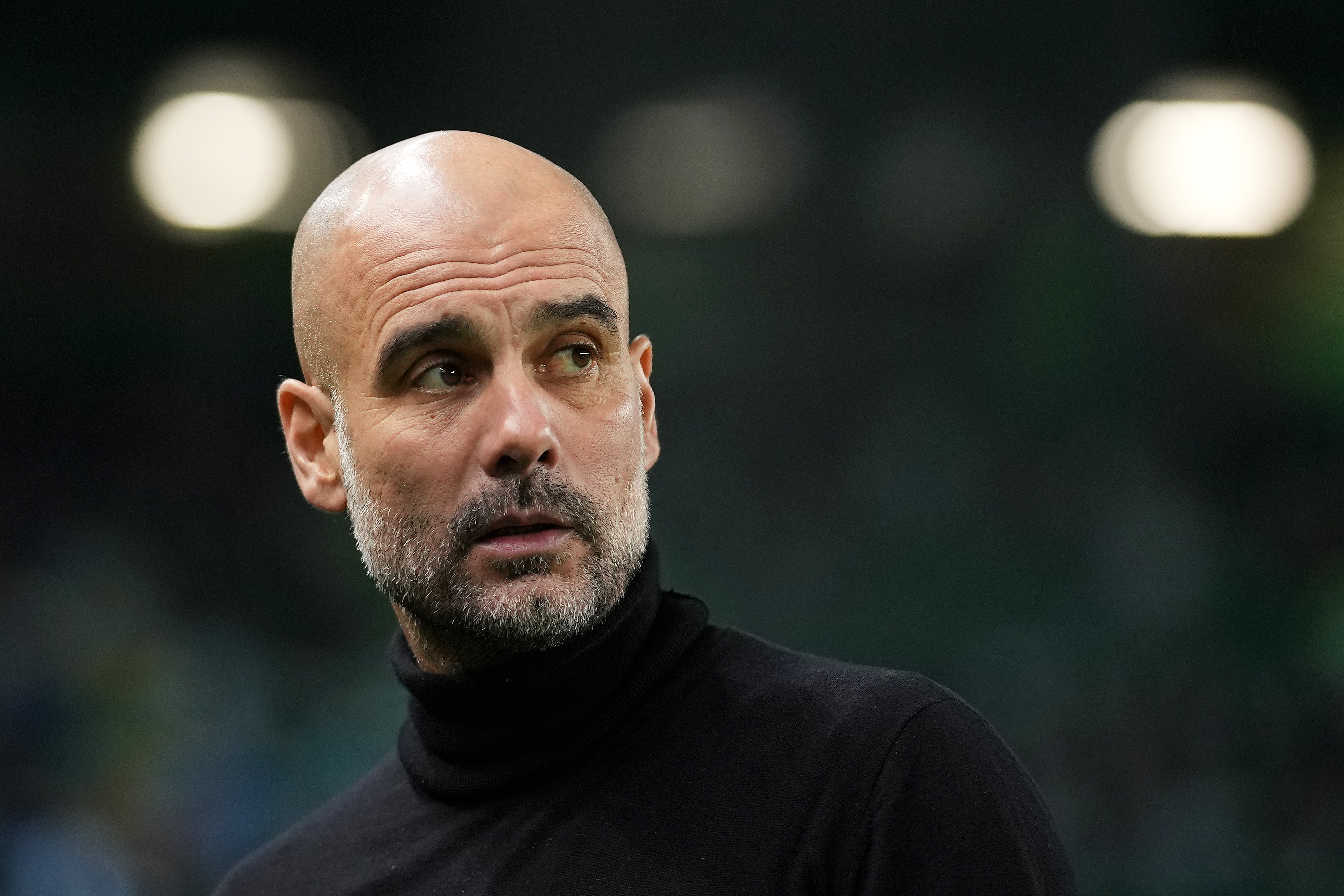 Pep Guardiola looks on at the Estadio Jose Alvalade in the Champions League