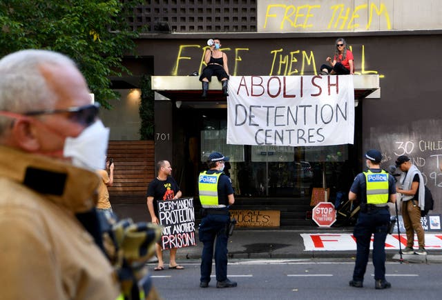 <p>Pro-refugee activists outside the hotel where tennis player Novak Djokovic was detained in Melbourne on 6 January</p>