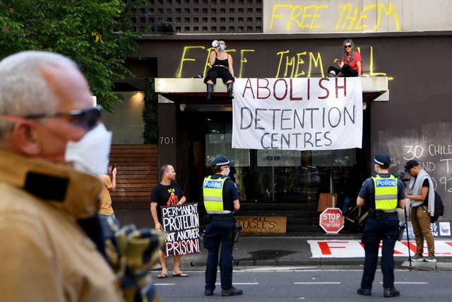 <p>Pro-refugee activists outside the hotel where tennis player Novak Djokovic was detained in Melbourne on 6 January</p>