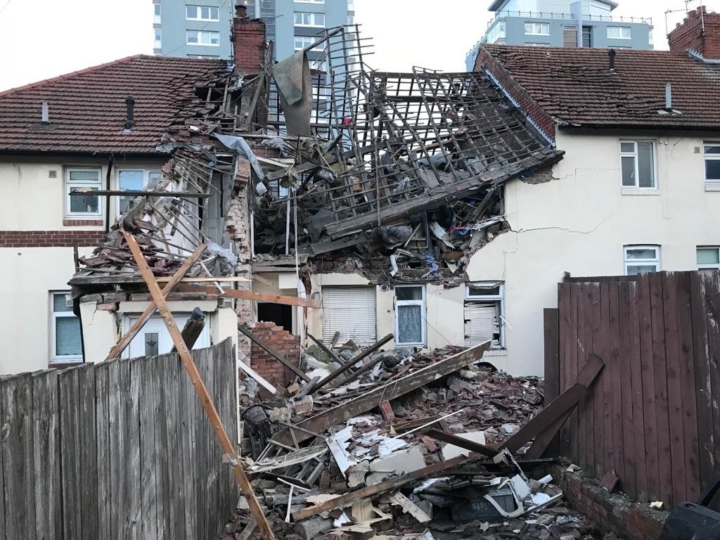 Both the front and rear walls are missing from the flat which was the most badly damaged in the blast and all the roof tiles were also blown off.