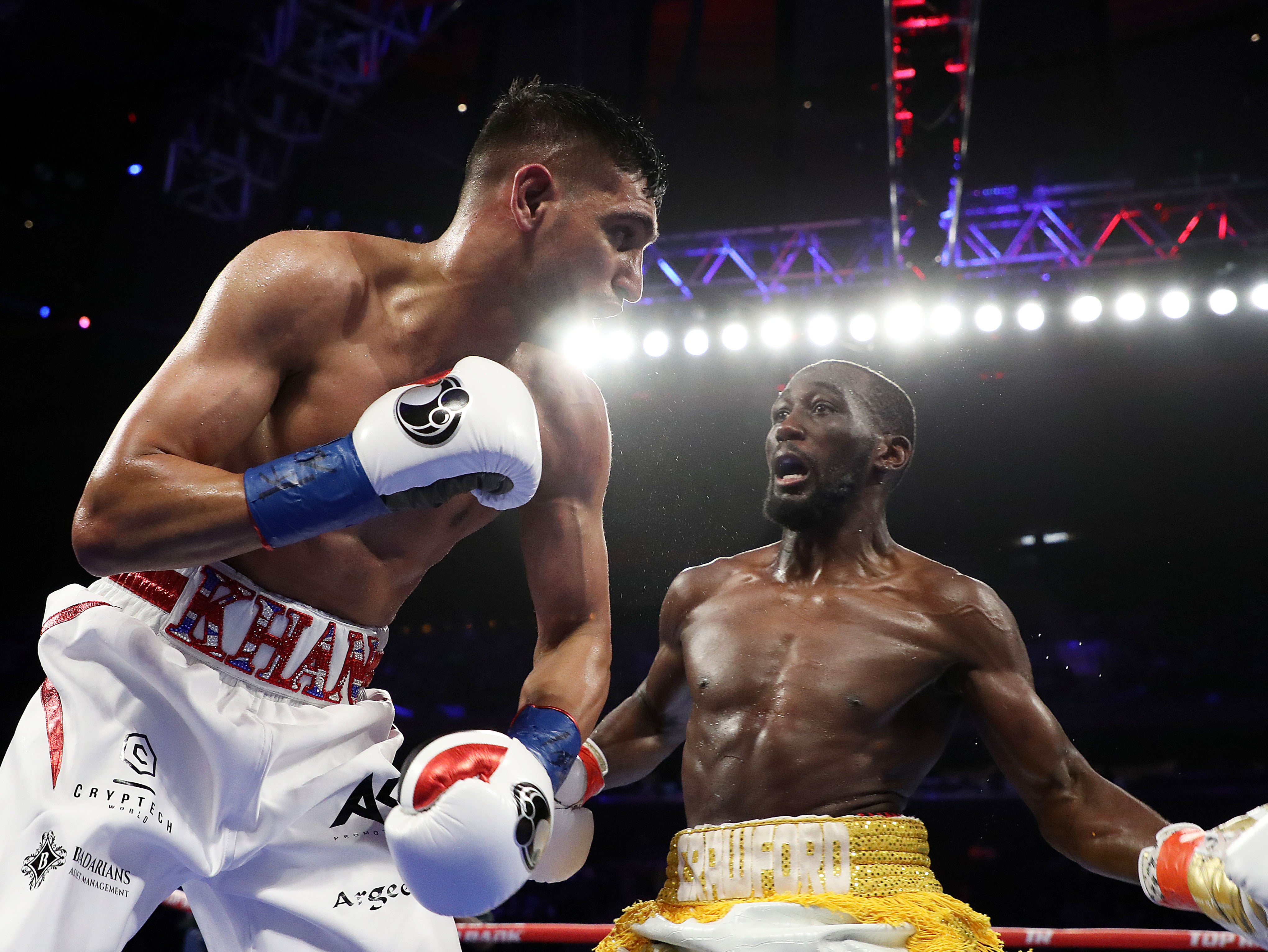 <p>Terence Crawford (right) has beaten both Amir Khan (left) and Kell Brook</p>