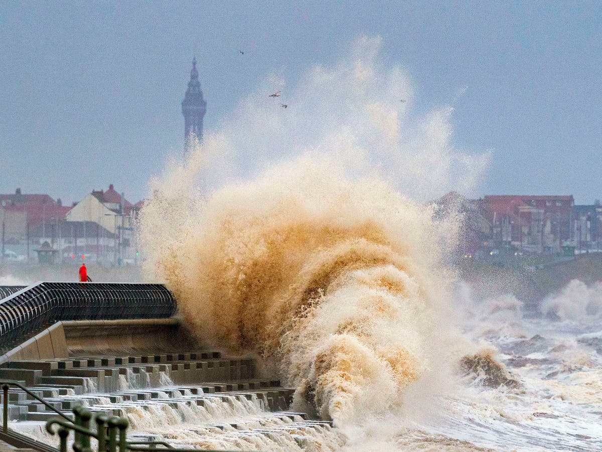 UK weather latest updates: Storm Eunice claims first victim as 100,000 lose power and hole torn in O2 roof