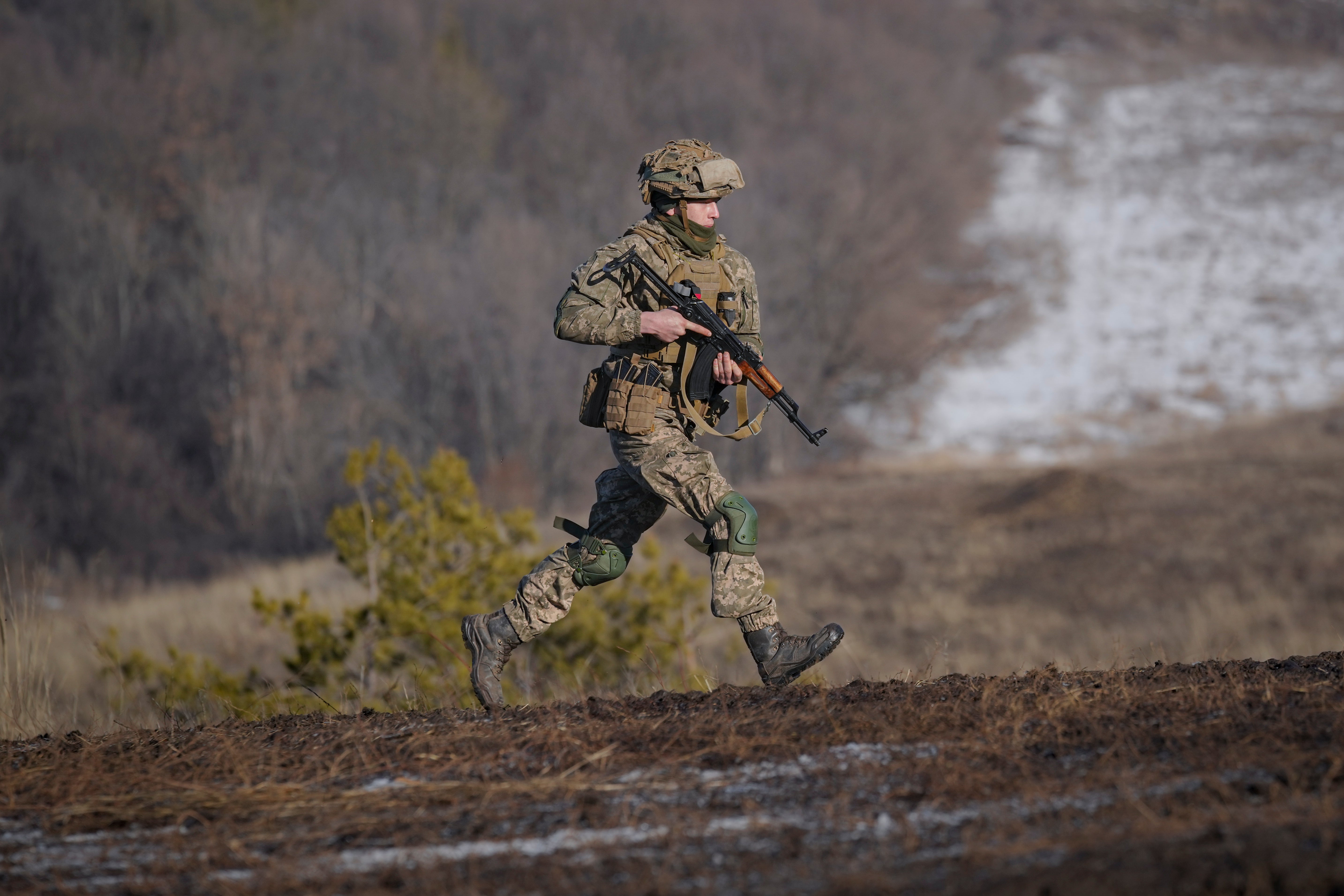A Ukrainian serviceman runs during an exercise in the Joint Forces Operation in the Donetsk region, eastern Ukraine (Vadim Ghirda/AP)