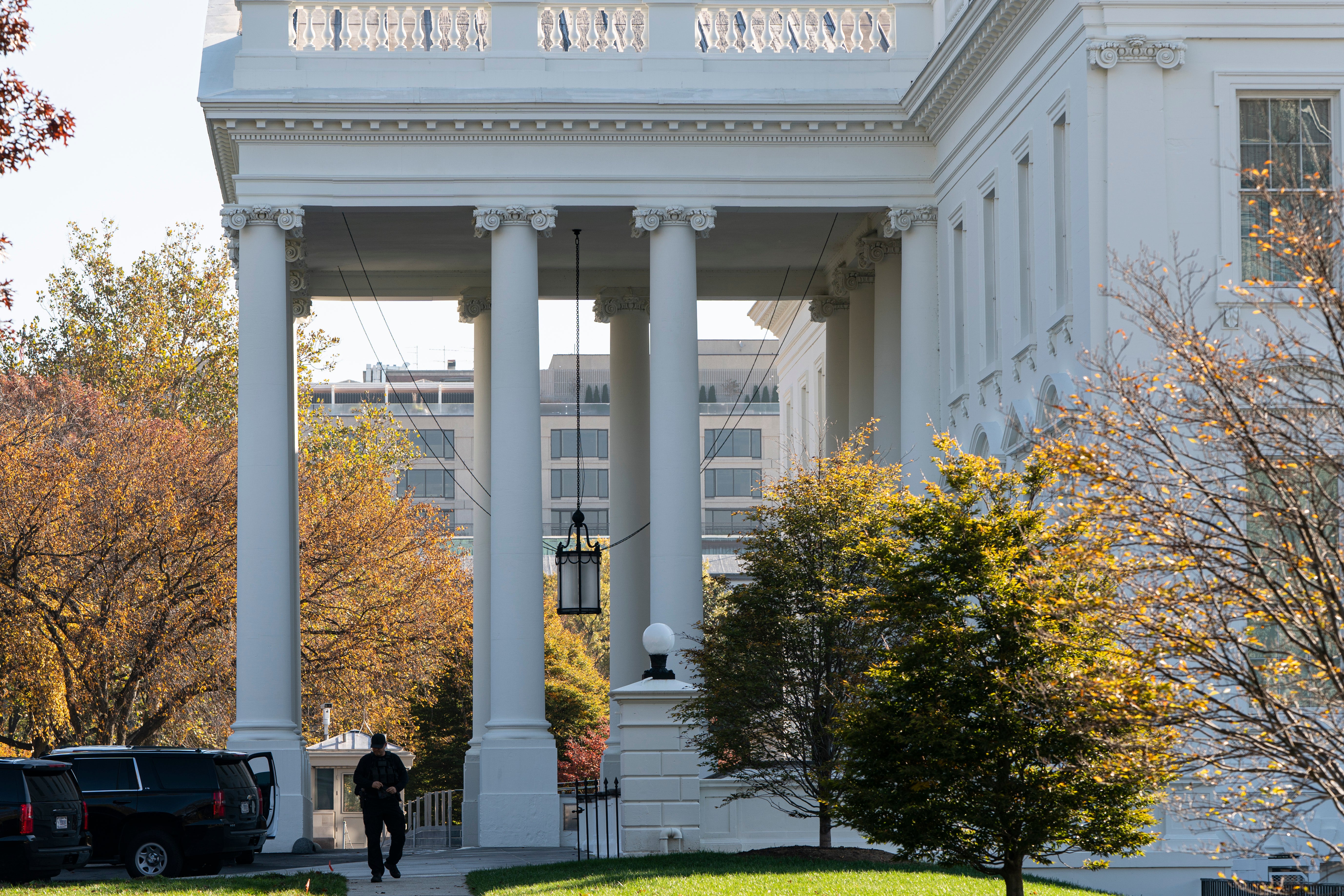 A Secret Service officer patrols at the White House on November 9, 2020 in Washington, DC (Photo by Joshua Roberts/Getty Images)