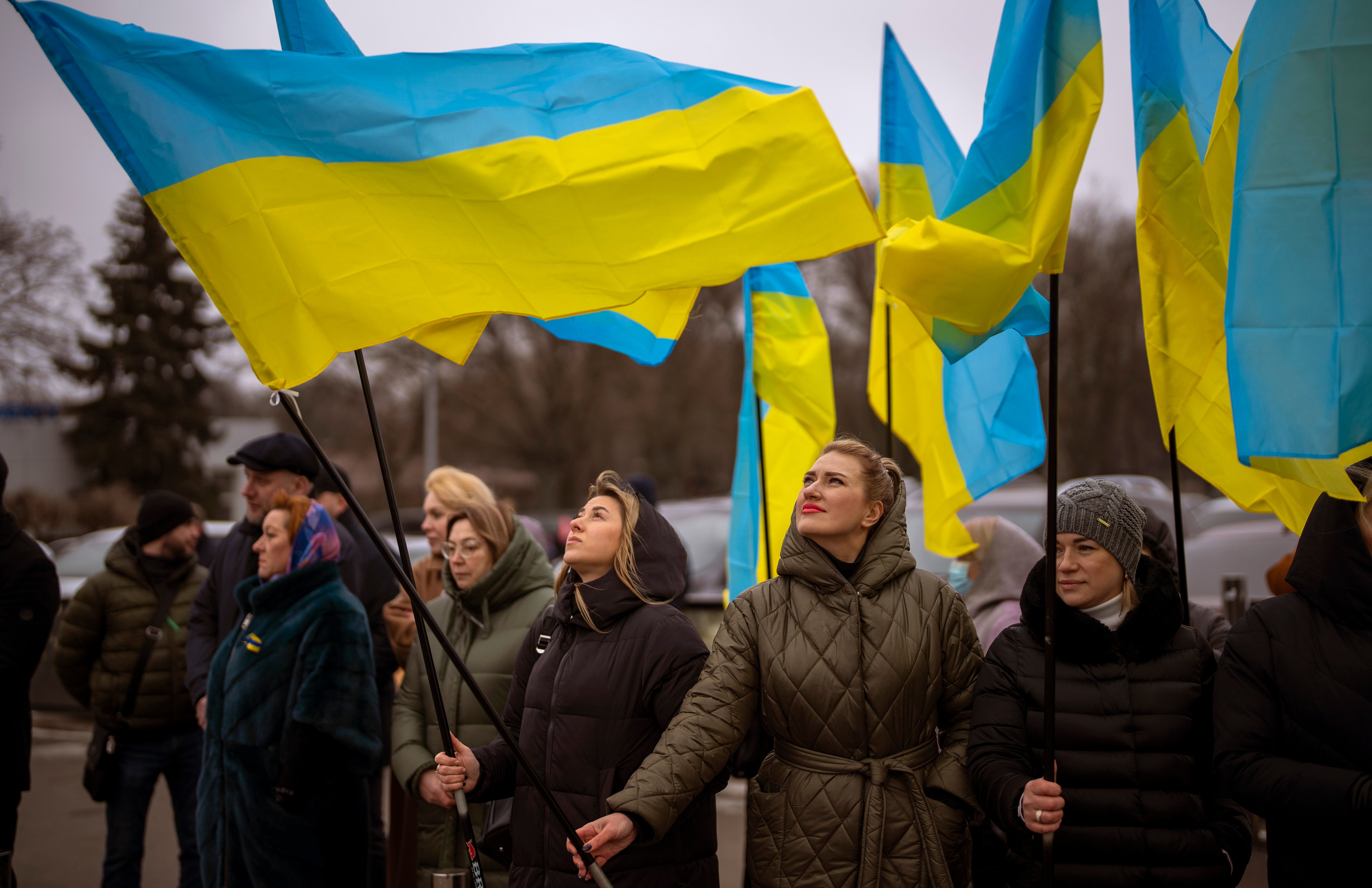 Women in Odessa hold Ukraine flags on Wednesday to mark a ‘Day of Unity’ amid the threat of a Russian invasion