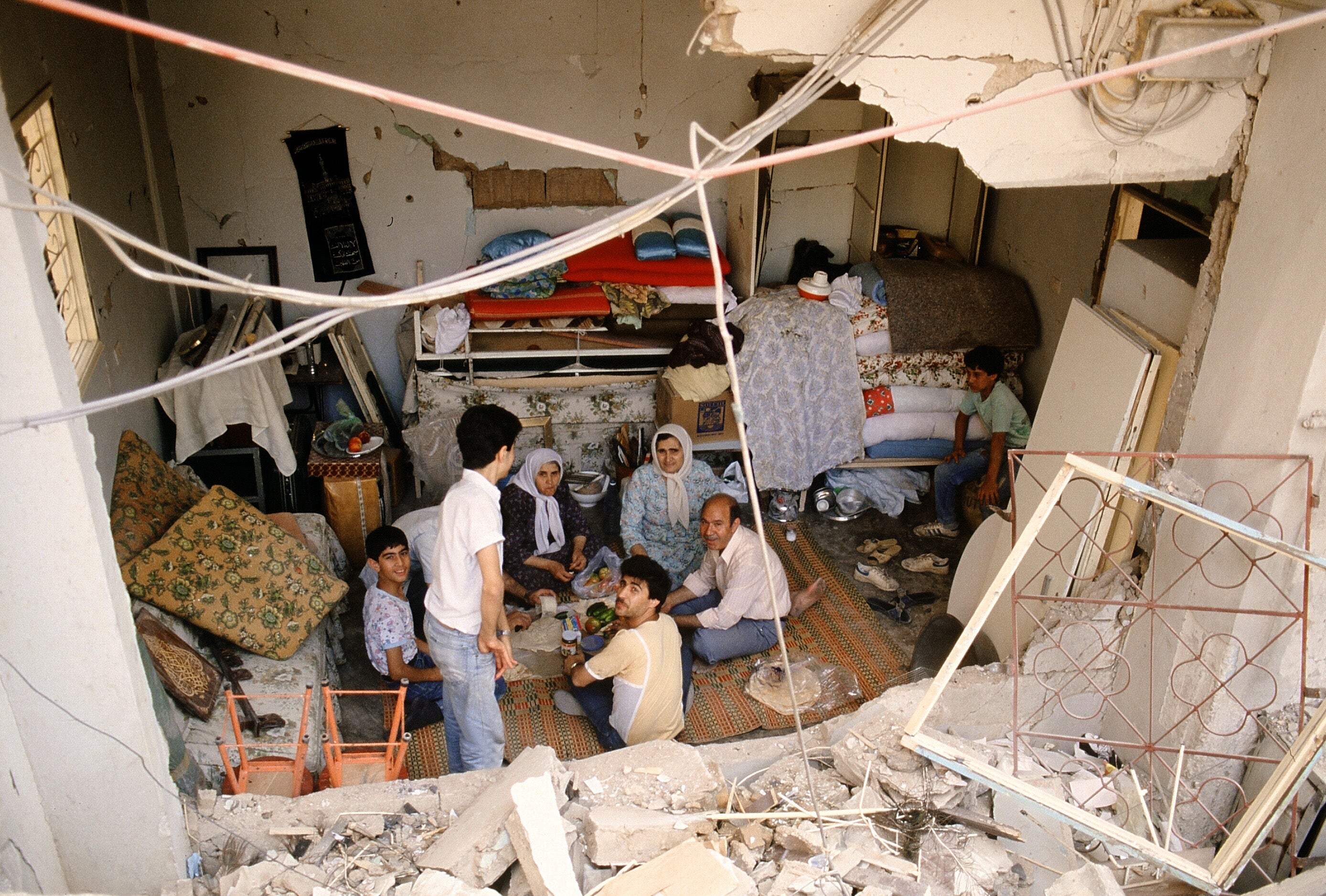 Palestinian refugee families who fled the fighting shelter in Moussaitbe, west Beirut, in 1985