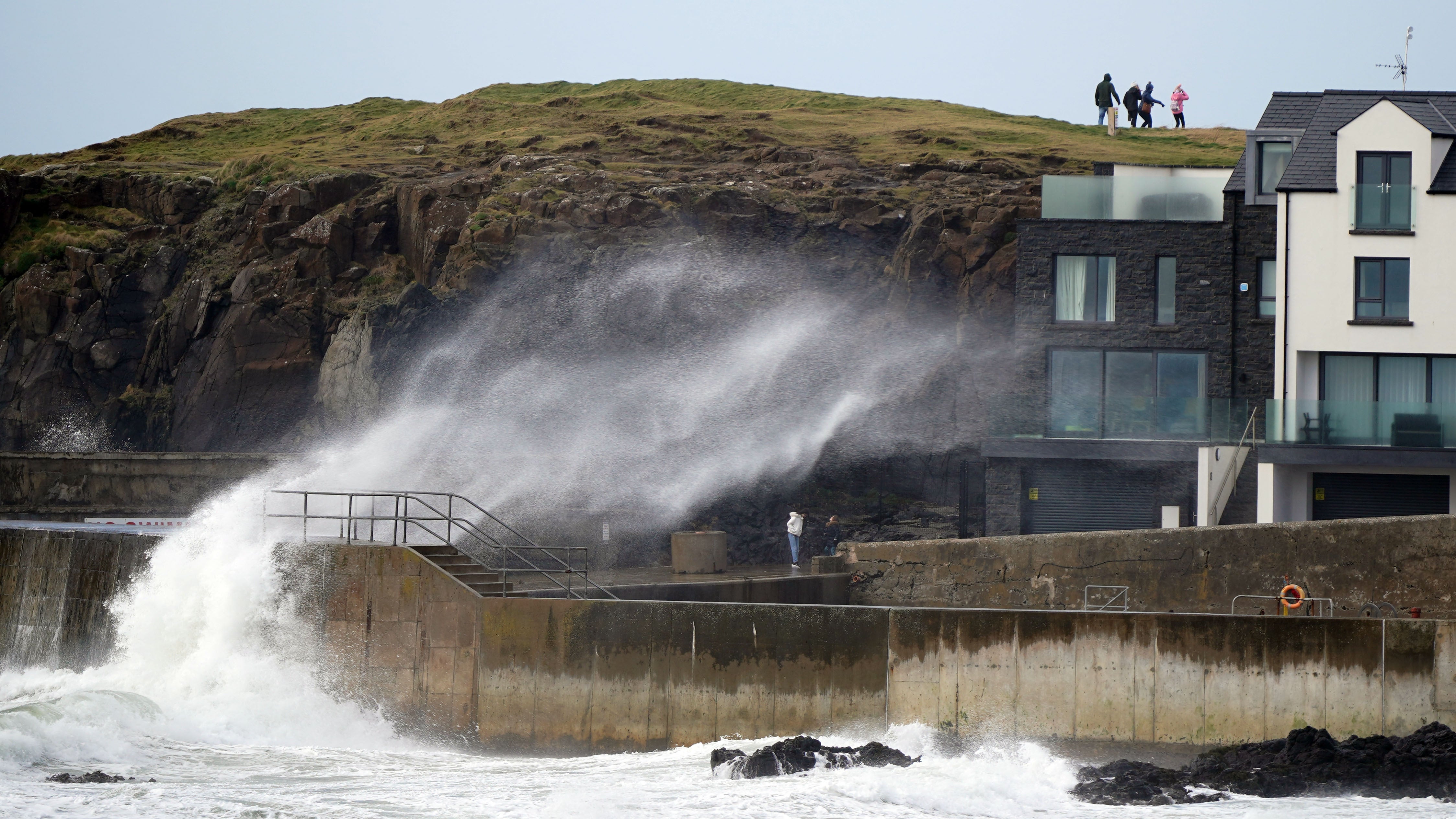 Big waves hit the sea wall at Portstewart in Co Londonderry, Northern Ireland (Niall Carson/PA)