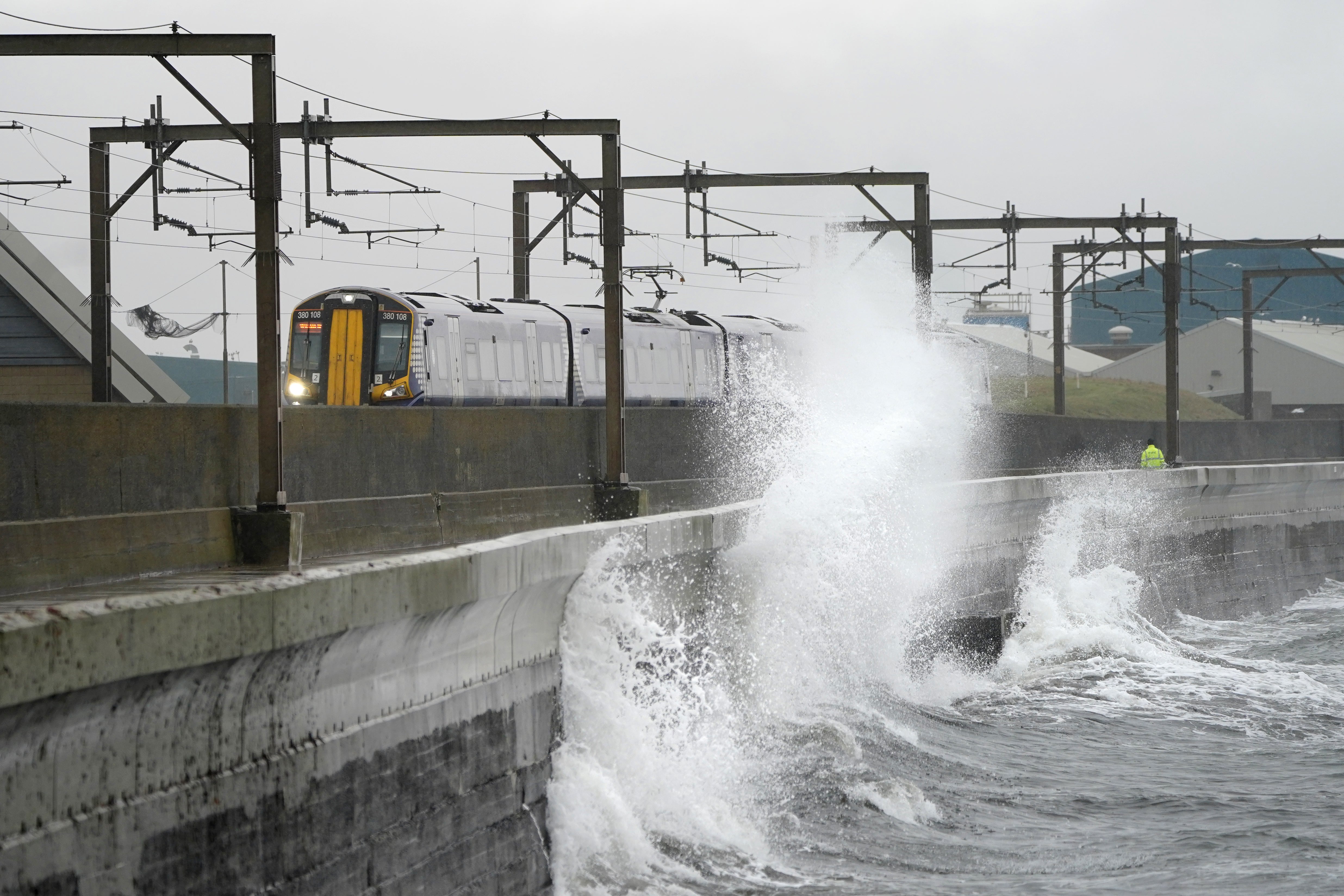 Waves crash against the sea wall at Saltcoats in North Ayrshire (Jane Barlow/PA)