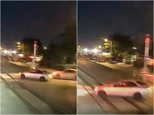 <p>Video screenshots from a train cab shows moments before car crossing the tracks is hit</p>