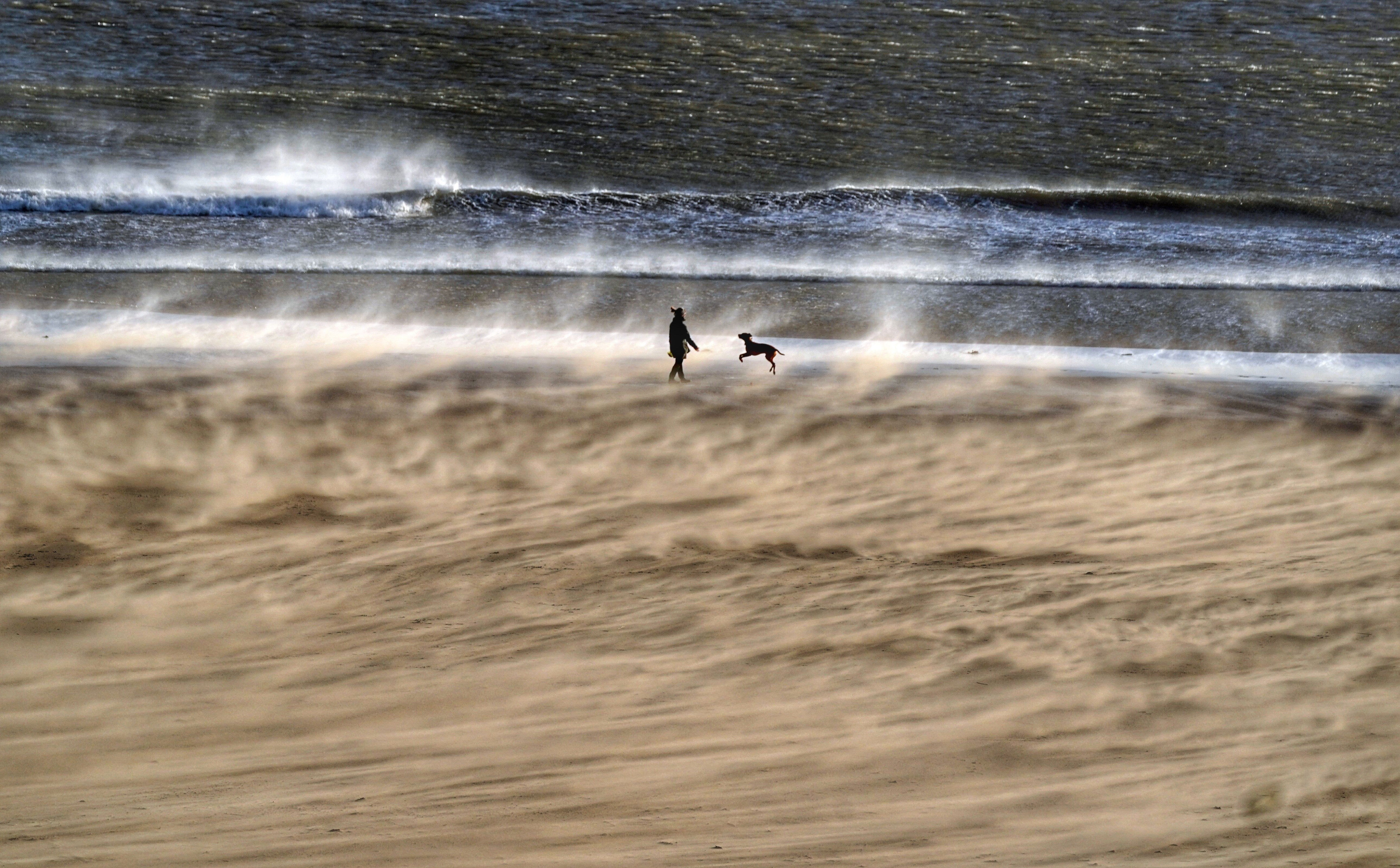 Strong winds on Tynemouth Beach in North Tyneside (Owen Humphreys/PA)
