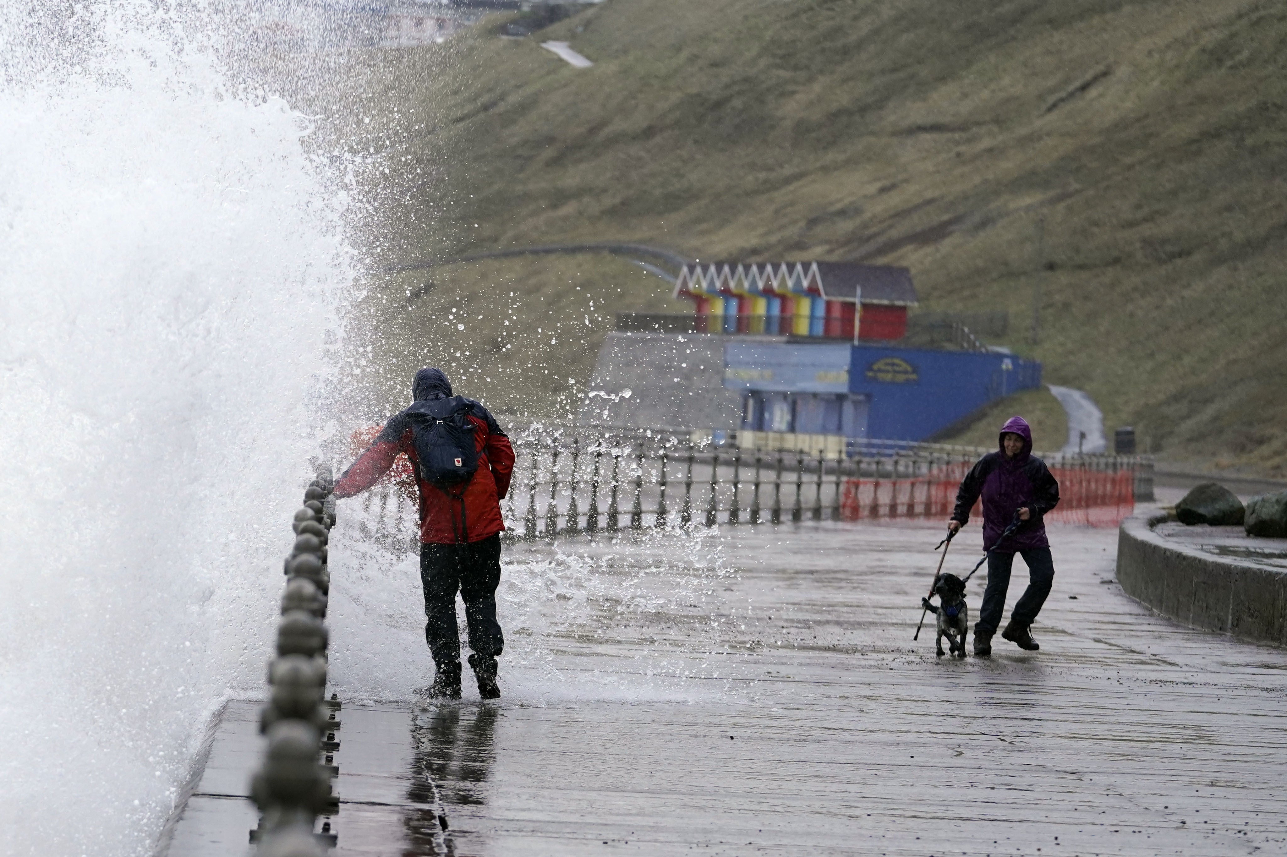 Big waves hit the sea wall at Whitby, North Yorkshire (Danny Lawson/PA)