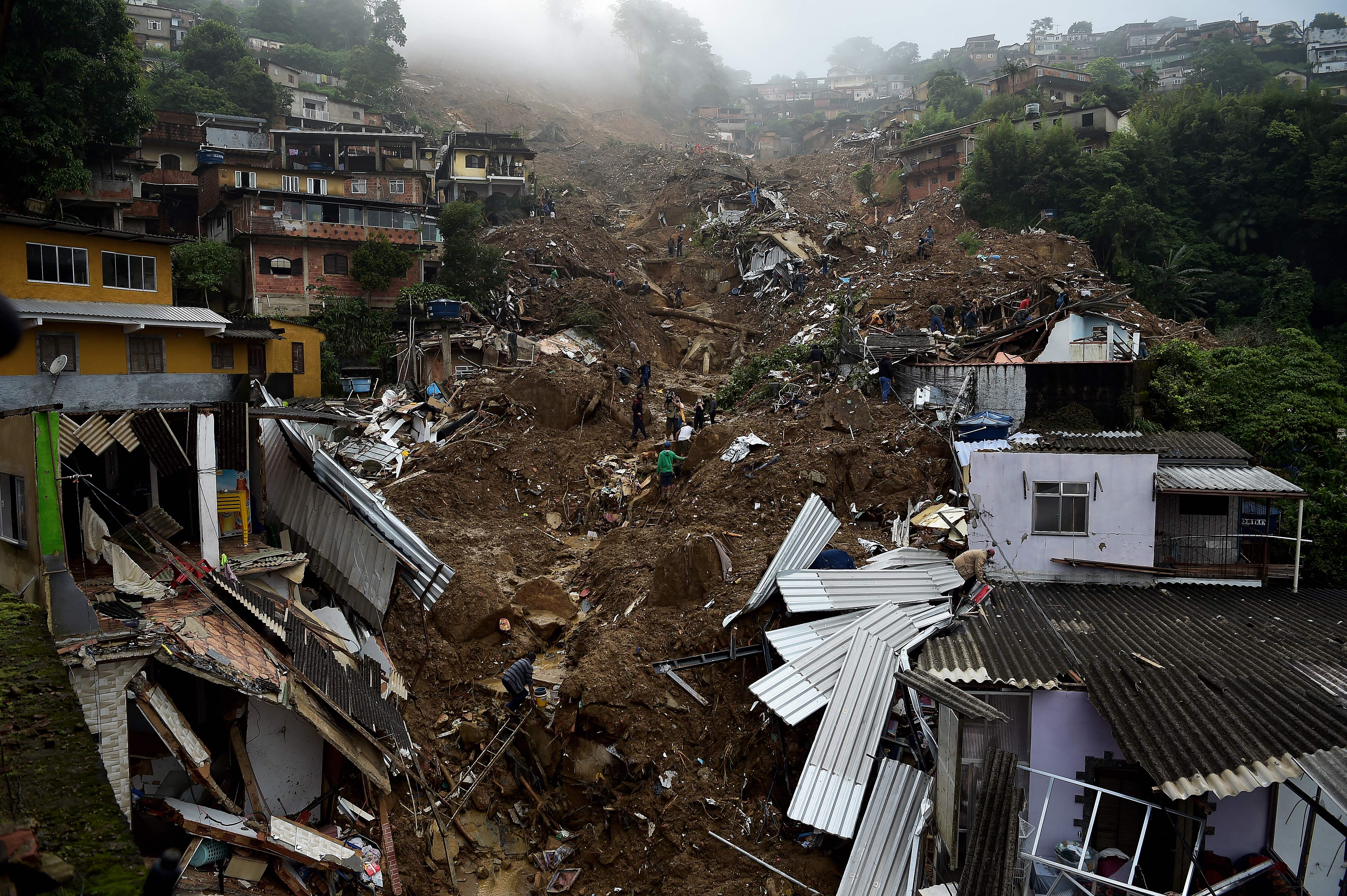 Large scale flooding destroyed hundreds of properties and claimed at least 58 lives in the area