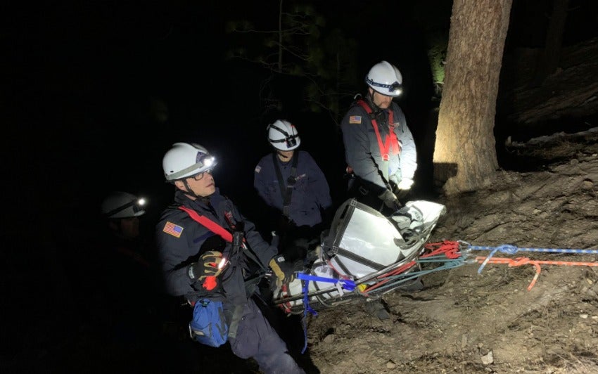 A Nevada woman was rescued after being found dangling from a tree on a steep slope
