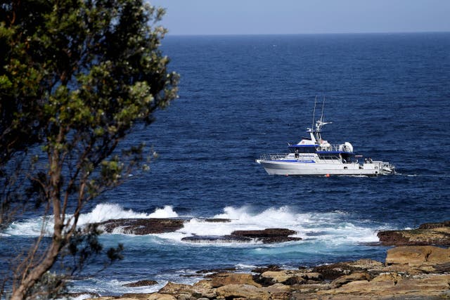 <p>A fisheries boat patrols the site of a fatal shark attack off Little Bay Beach in Sydney on 17 February 2022</p>