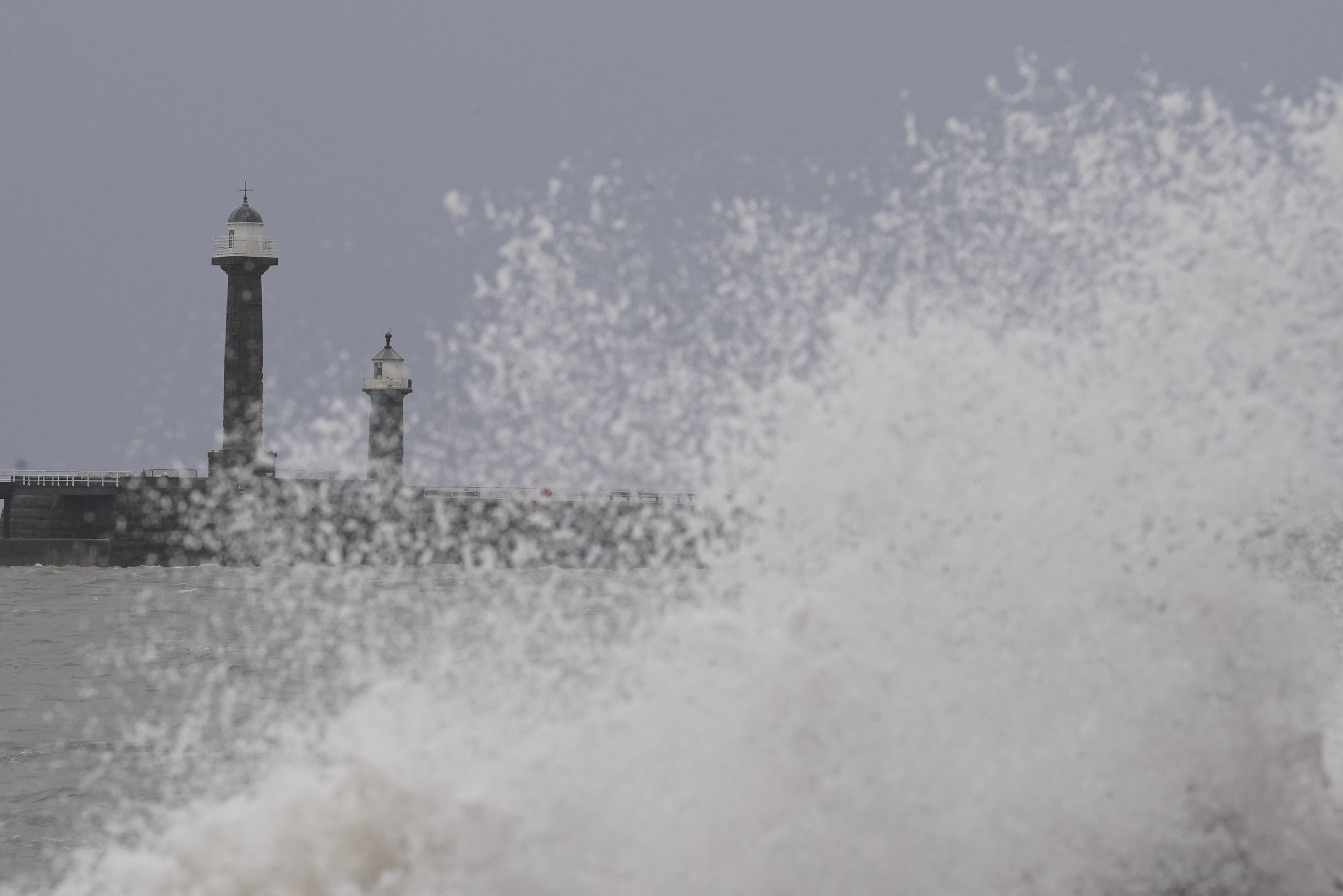 Waves hitting the sea wall in Whitby as Storm Dudley swept into the UK (Danny Lawson/PA)
