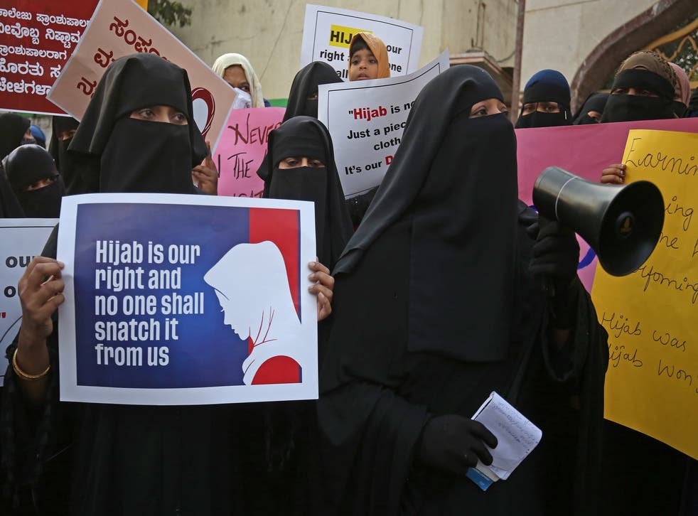 <p>Members from different organization and Muslim women wearing Hijab attend a protest in Bangalore</p>