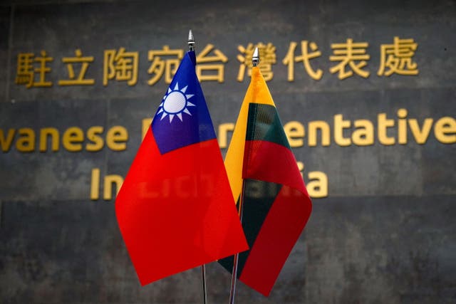 <p>Taiwanese and Lithuanian flags are displayed at the Taiwanese Representative Office in Vilnius, Lithuania</p>