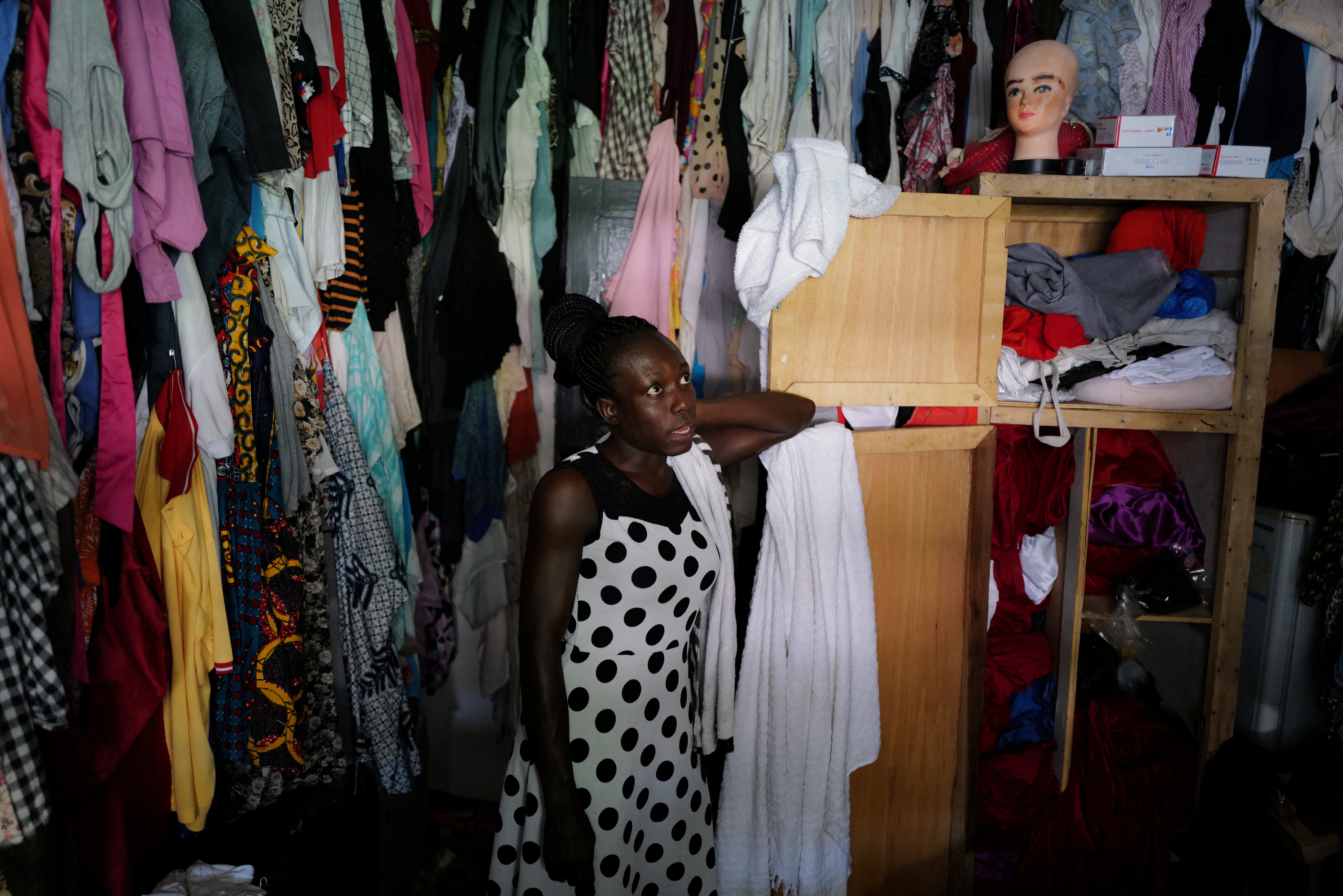 Fiatsi stands inside her wardrobe