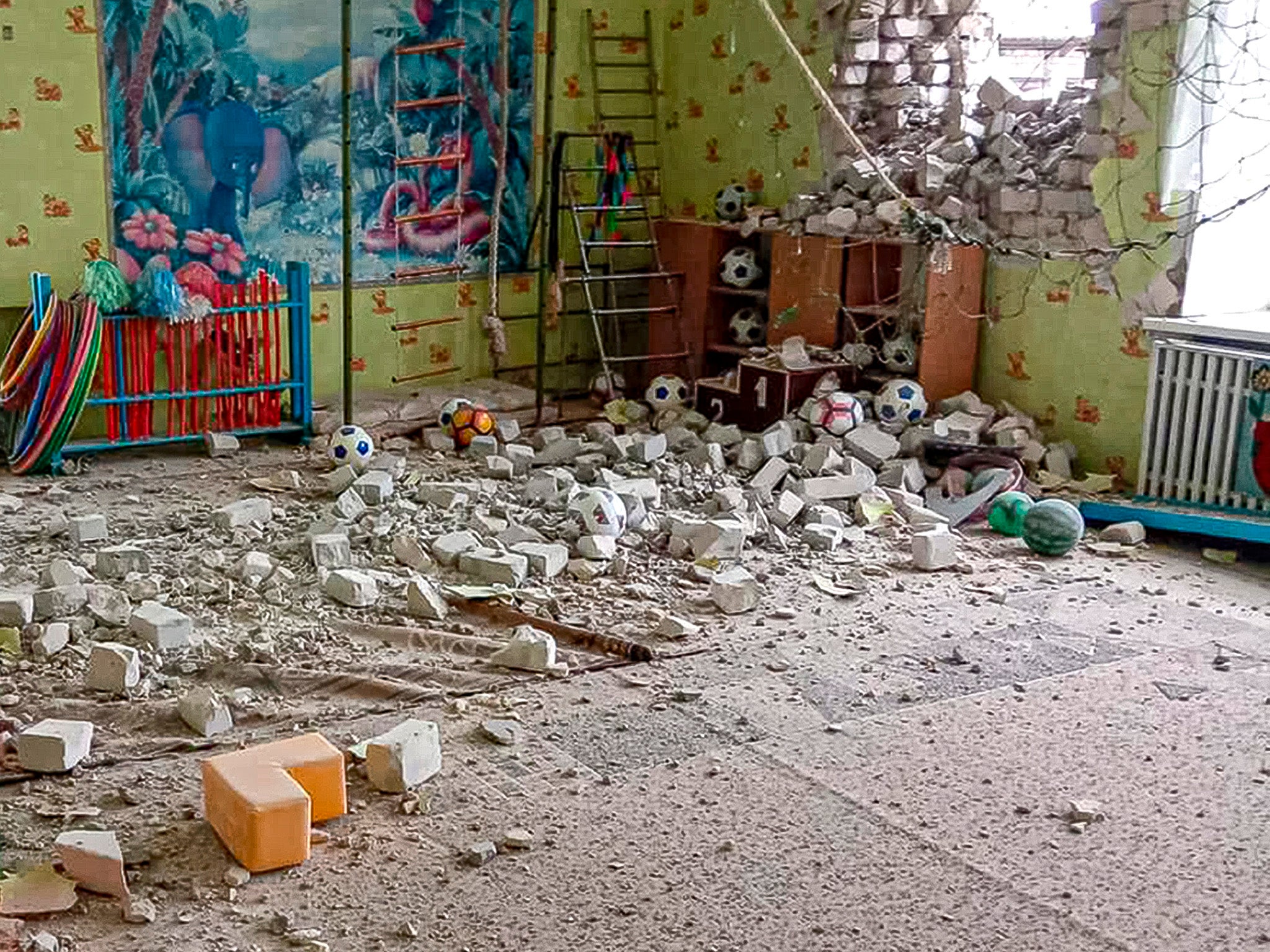 This handout photo, released by Ukrainian Joint Forces Operation, shows a view of a kindergarten building after alleged shelling by separatists forces in Stanytsia Luhanska, eastern Ukraine, on Thursday