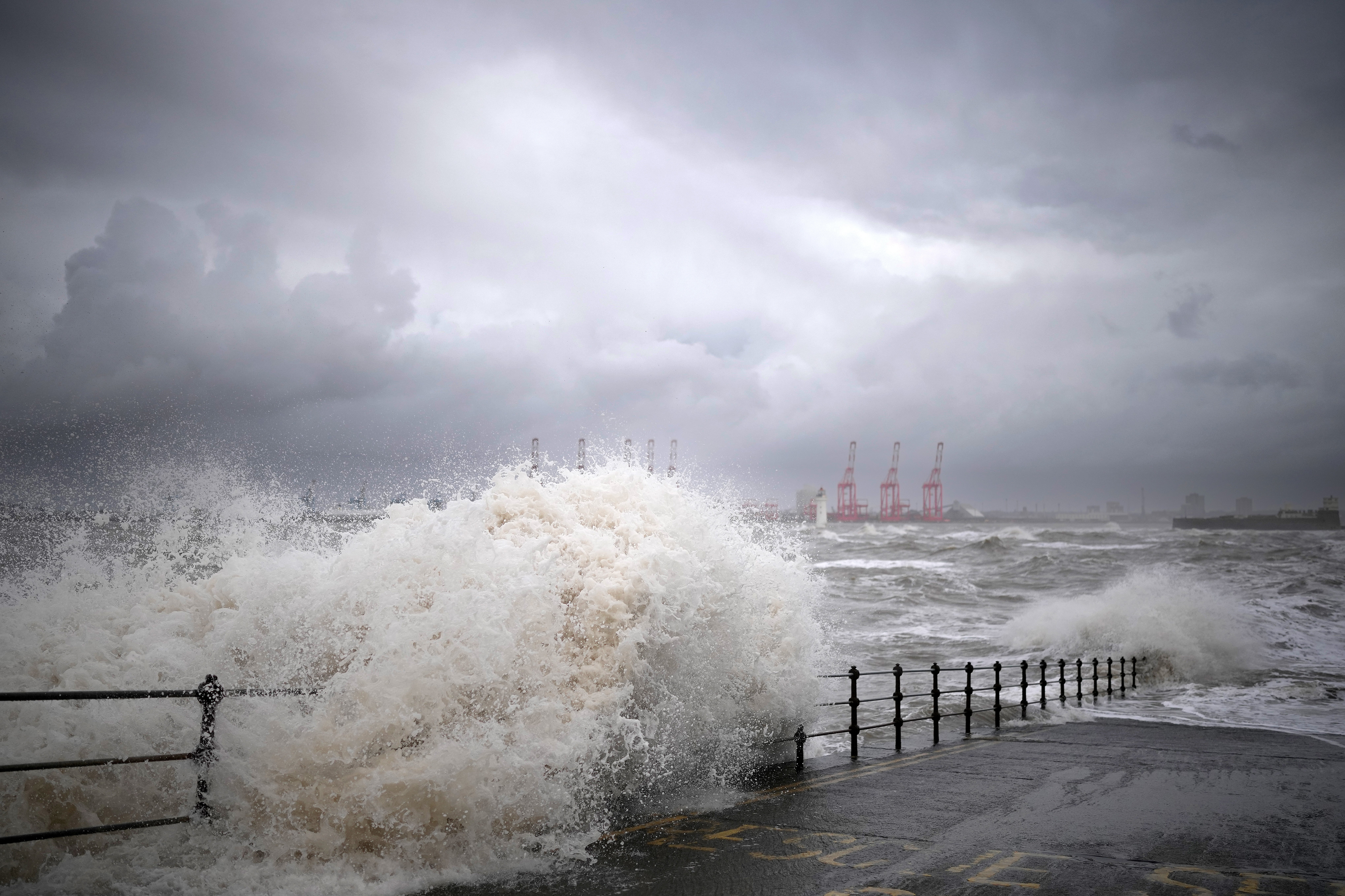 Waves created by high winds and Spring tides hit the sea wall at New Brighton promenade in Liverpool
