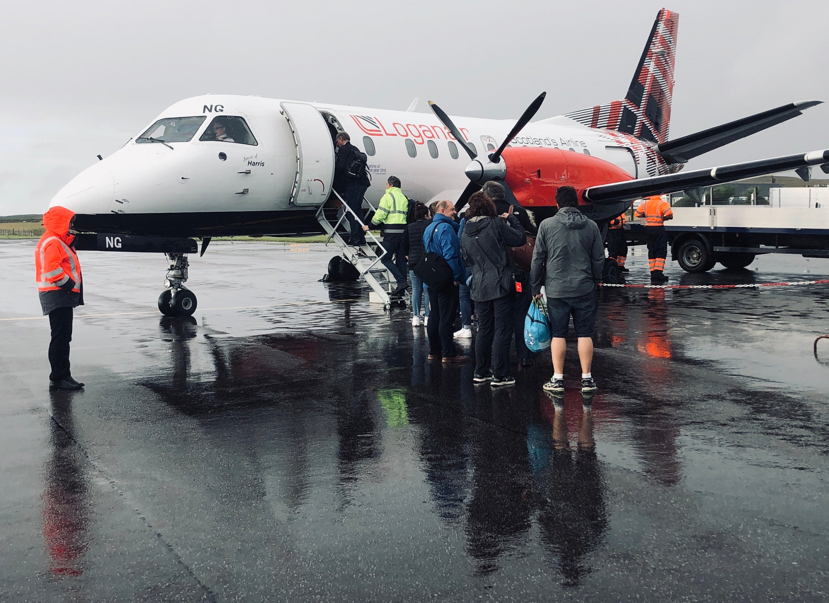 Keep going: Loganair passengers boarding a flight in Islay