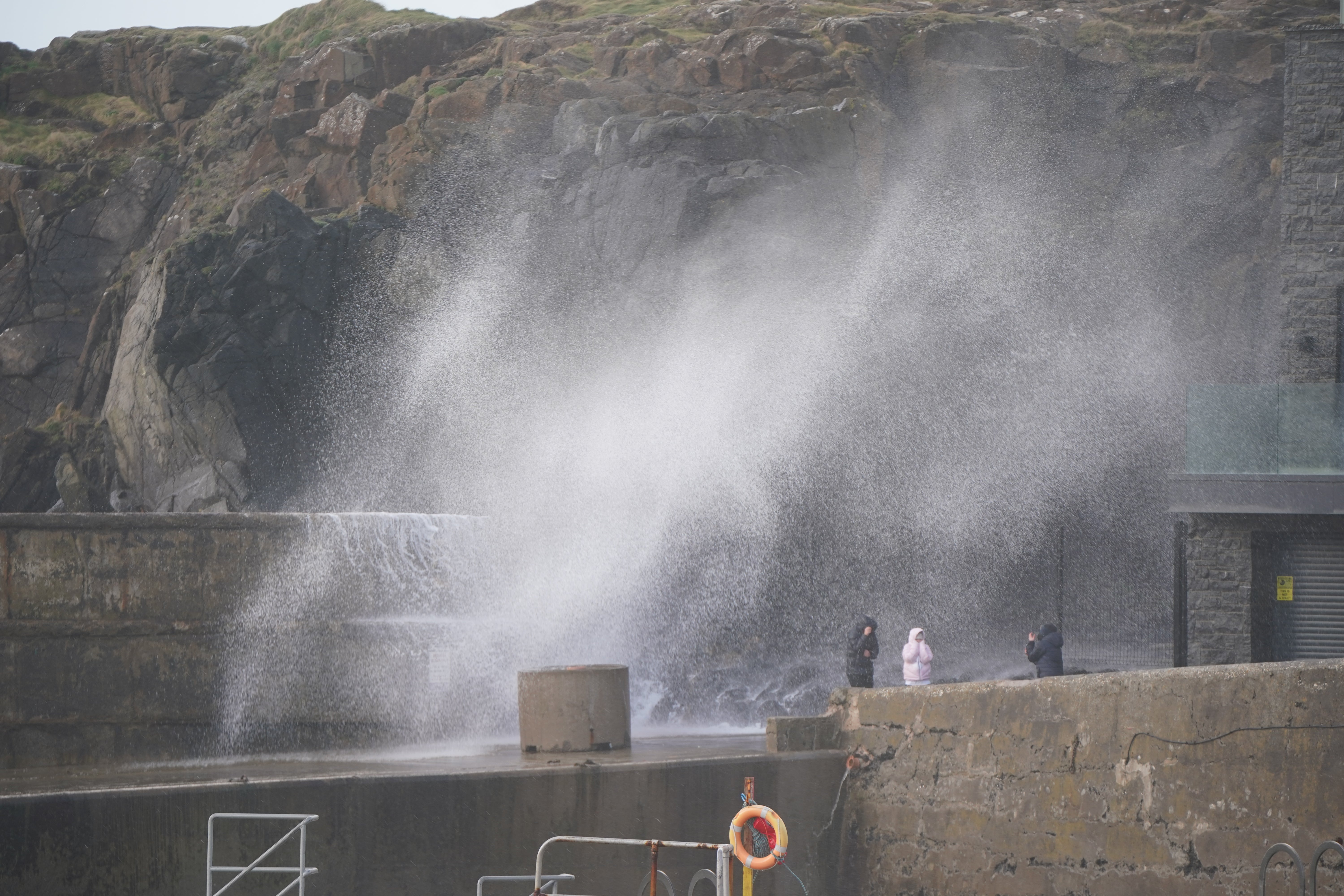 Waves hit the sea wall at Portstewart in Co Londonderry (Niall Carson/PA)