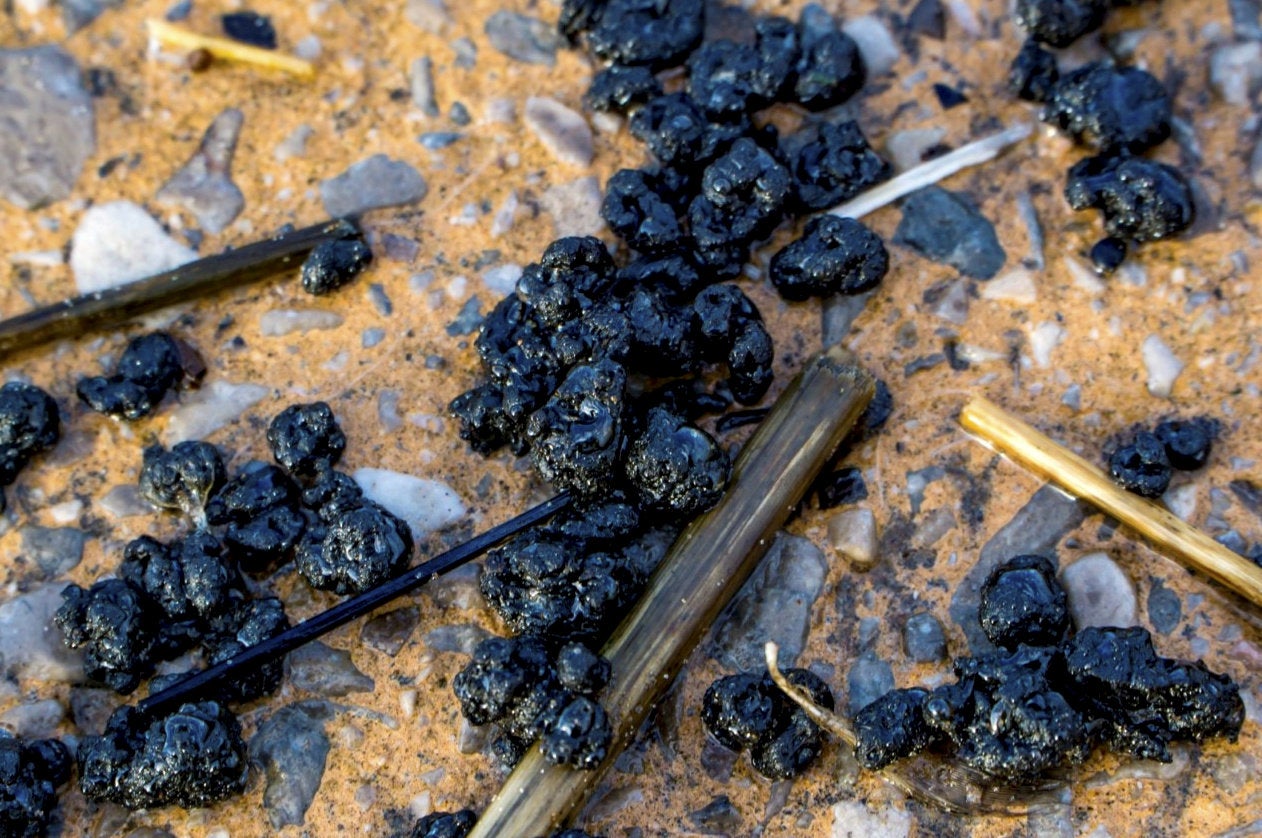 Thousands of balls of tar have washed up on Blackpool beach in Lancashire, sparking a major clean-up operation