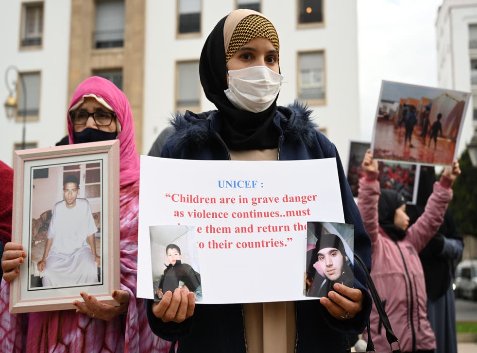 <p>People demonstrate during a gathering called by the National Coordination of the Families of Moroccans detained in Syria and Iraq, in front of the parliament building, in Rabat, Morocco, 28 January 2022</p>