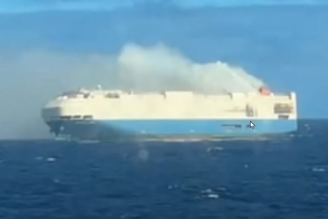 <p>The vessel is on fire in the middle of the ocean.</p>
