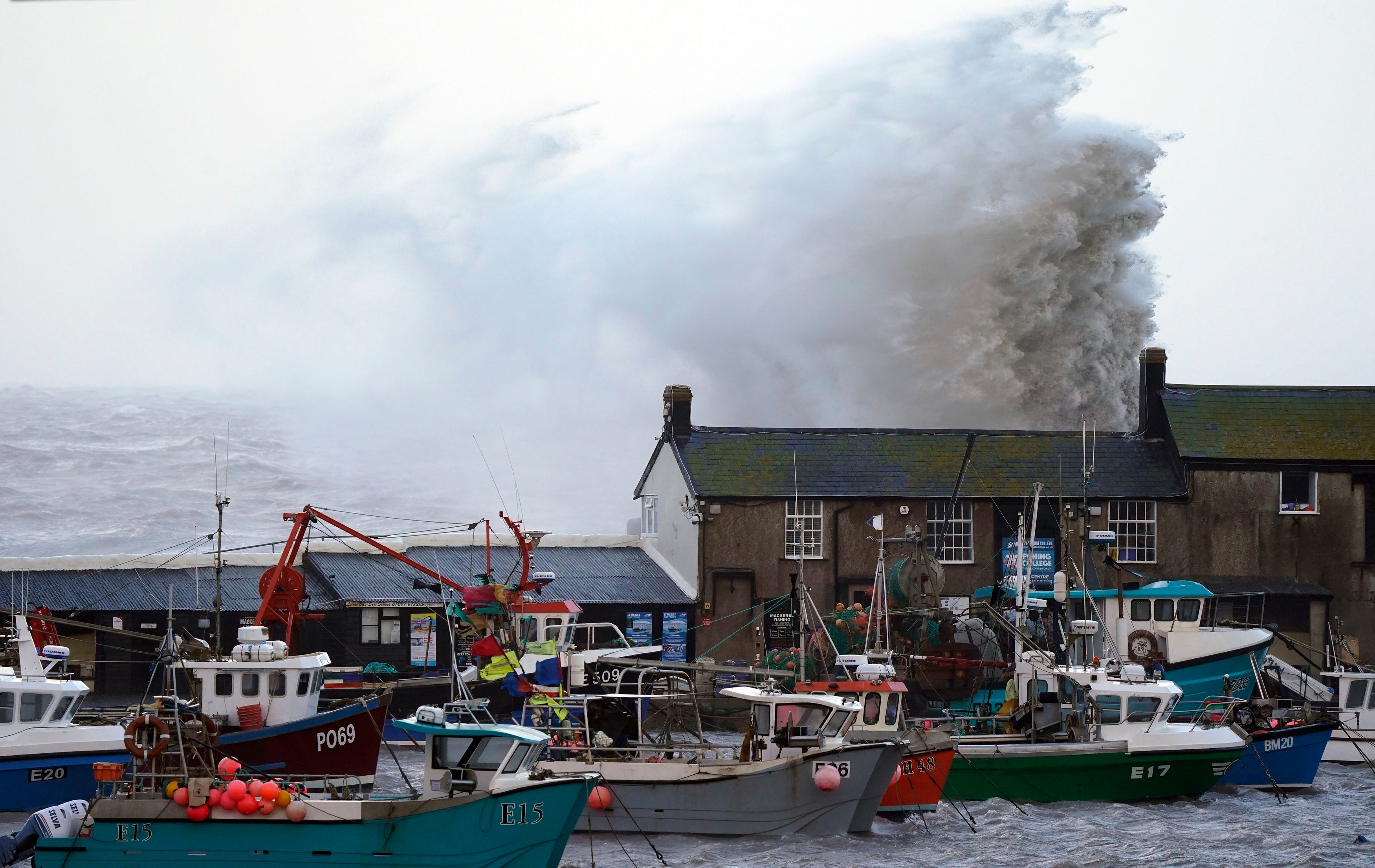 Large waves spray building on harbour